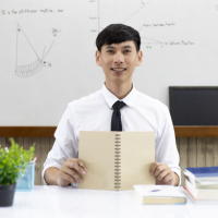 A male professional sitting on study table