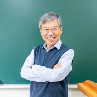 Academic writer in front of board